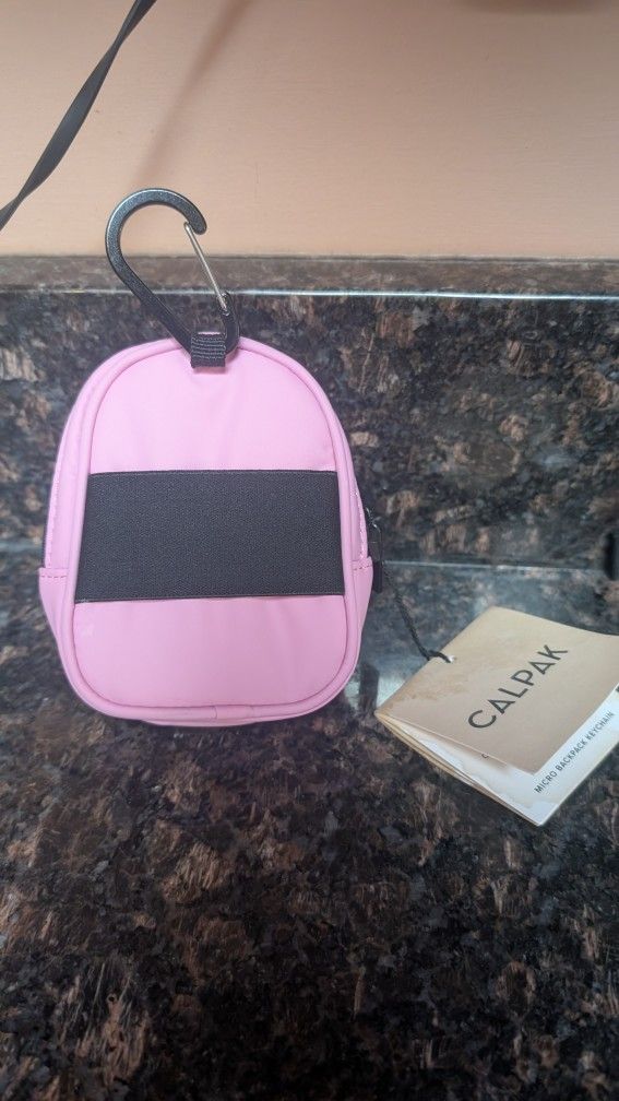 Brand new Calpak Micros Backpack Keychain In bubblegum!