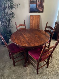Vintage solid Oak pedestal dining table with 5 ladder back cane woven seat chairs