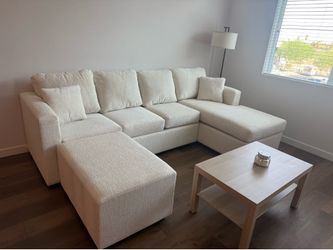 Brand new cream sectionals with free ottoman