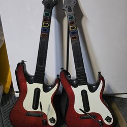 Two Wireless Guitar Hero / Band Hero Guitars for the Xbox 360 Console 