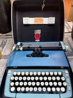 SCM Sterling Portable Typewriter with Case