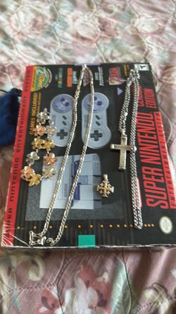 Silver necklaces and wrist band