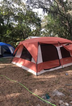 Two tents blue one is 8 man tent orange one is a 12 man
