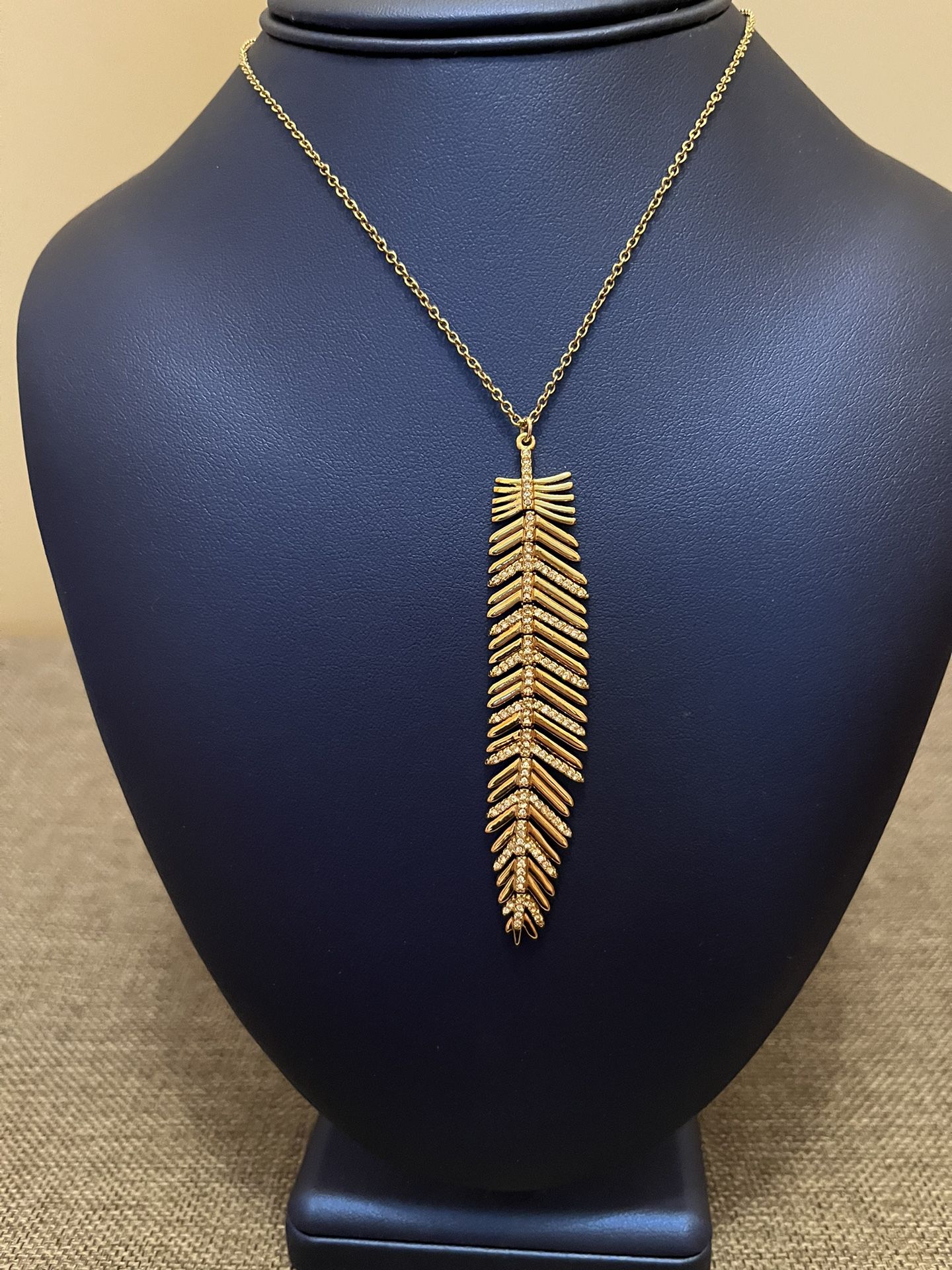 Fancy feather pendent with chain. Swarovski crystals and in gold color. The chain is adjustable. New no tags  Very pretty item 