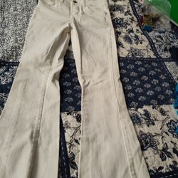 Levi's Woman's Mid Rise Flare Cream colored jeans Size 10 Reg or 29" waist used