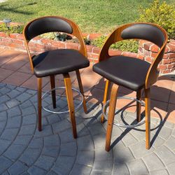 Two swivel bar stools