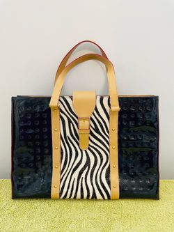 Beautiful Arcadia patent leather black tote with tan leather trim and zebra pony hair