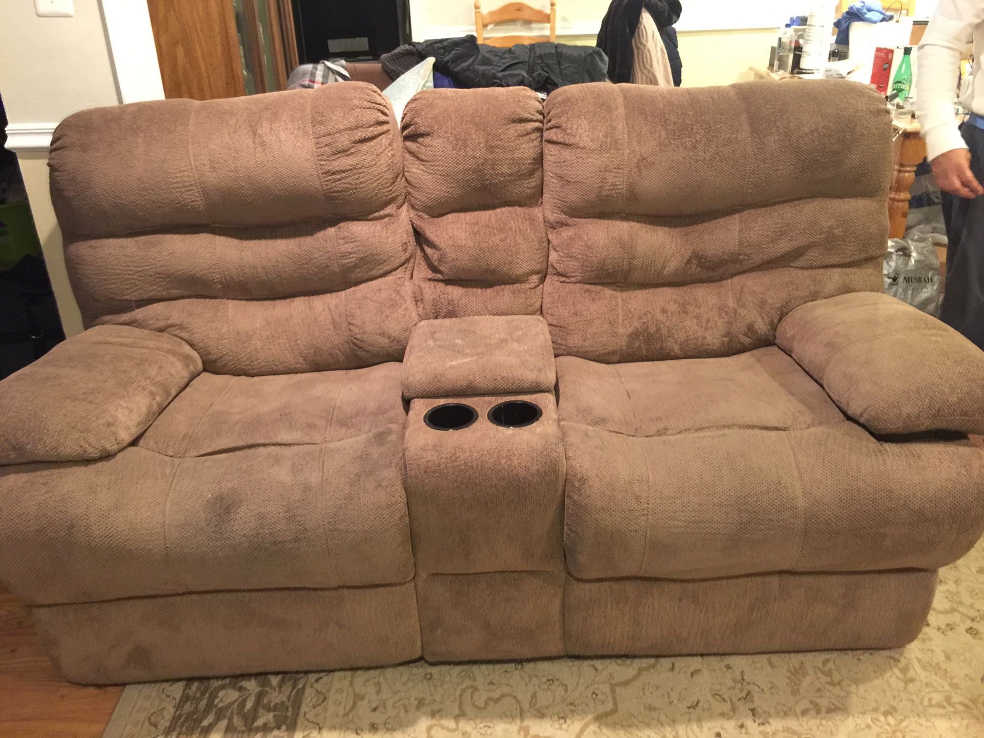 Recliner love seat, solid and good condition also it’s electric recliner