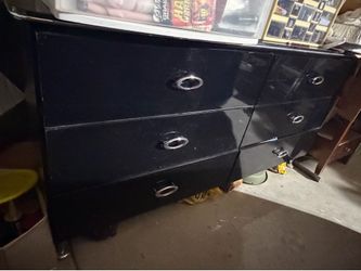 Black dresser with a mirror