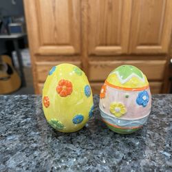 Ceramic Decorated Easter Egg Pair of salt and pepper shakers.  Size approximately 2 1/2 inches tall.  Preowned never used.  Has been on display in a c