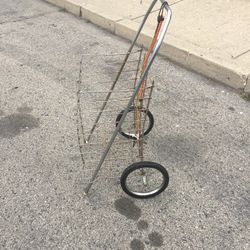 A GROCERY SHOPPING CART /LAUNDRY CART WITH TWO BUNGEE CORDS LITE WEIGHT AND STURDY FOLDS FLAT USED IN GOOD CONDITION $20.00