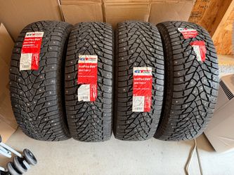 265/70/17 new studded tires snow winter
