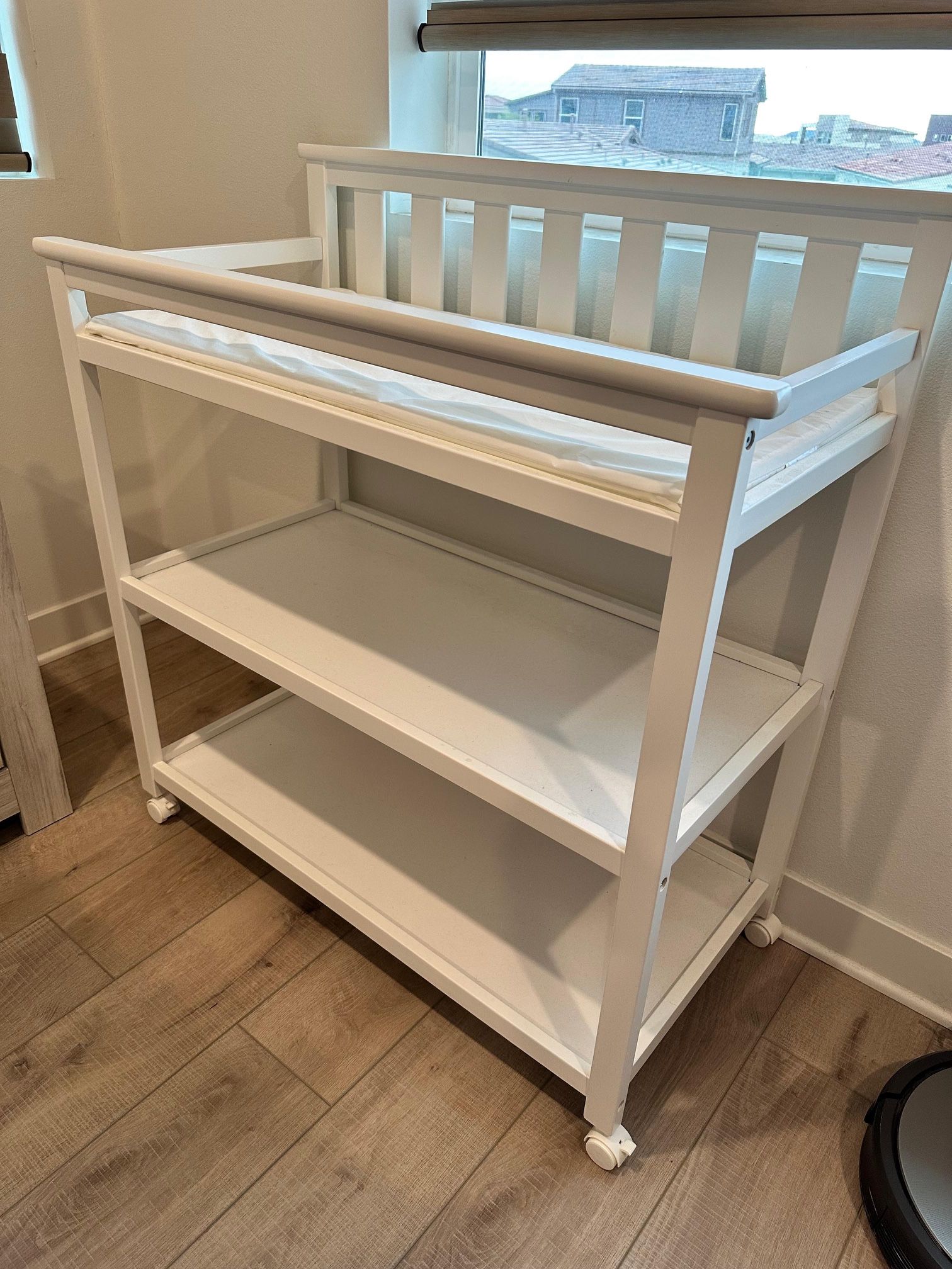 Delta Children Changing Table with Wheels and Changing Pad