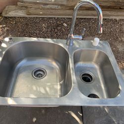 Stainless Less Sink , Faucet And G Disposal 