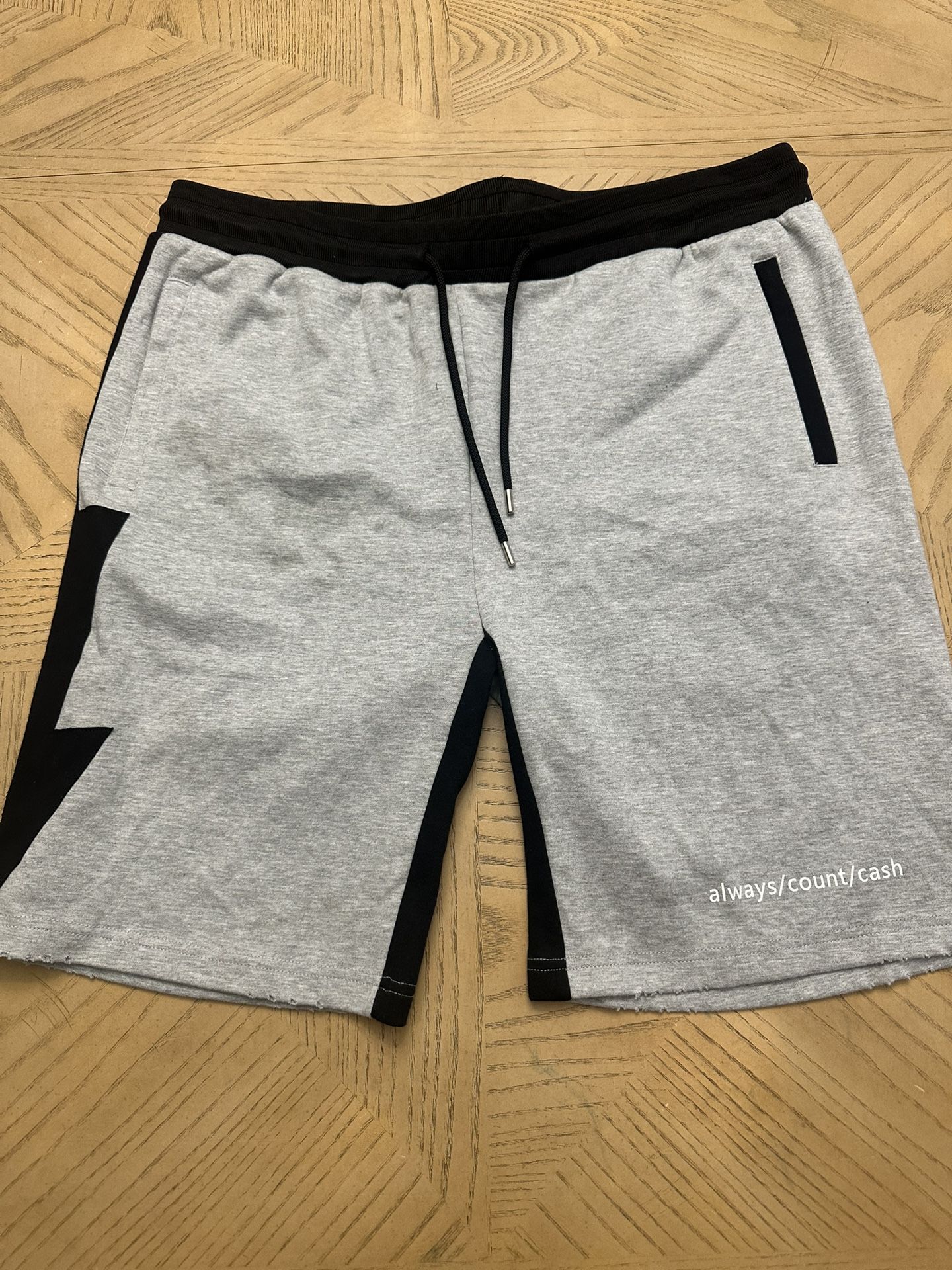 Sweatshirts Always Count Cash (ACC). They are specifically the brand's "Lightning" shorts. Size XXL