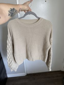 Beige knit sweater for cold weather, size M.