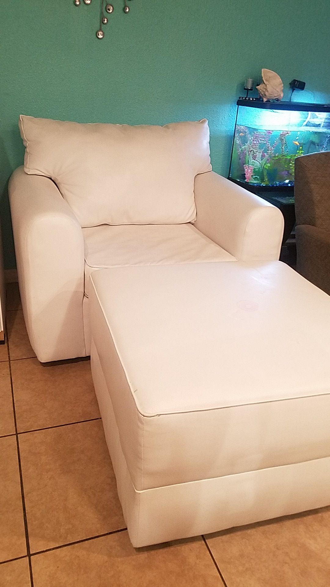 White leather couch with foor rest