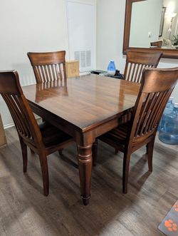 Real wood dining table and chairs and mirror