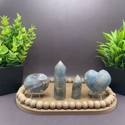 109 g 2“ x 2.2“ blue Onyx heart, 61 g 2 inches” by 1.5” palm stone, 76 g 3.1 inch tower and 35 g 2.0 inch tower carvings