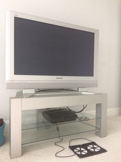 Panasonic plasma flat screen TV with matching surround sound system and stand