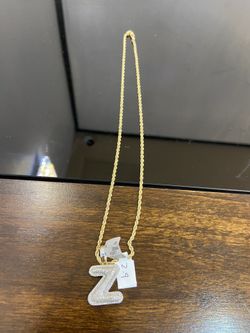 10k gold chain and real diamond pendant initial “Z” for a good price!!