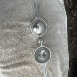 Durable metal citrus juicer for easy squeezing.