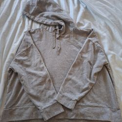 Cozy gray hooded sweatshirt with drawstrings. Perfect for casual wear. Banana Republic.