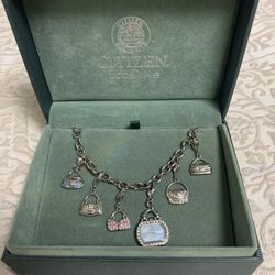 Citizen Ladies Blue Mother Of Pearl Purse Charm Watch Eco-Drive with Swarovski. 