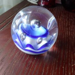 Glass Paperweight With Blue And White Flower Inside. Also 7 Bubbles.