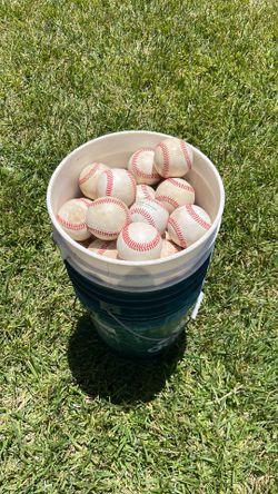 More than 100 little league size baseballs (a bucket and a half)