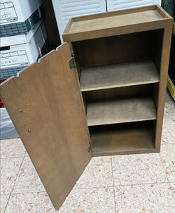 Wood storage cabinet