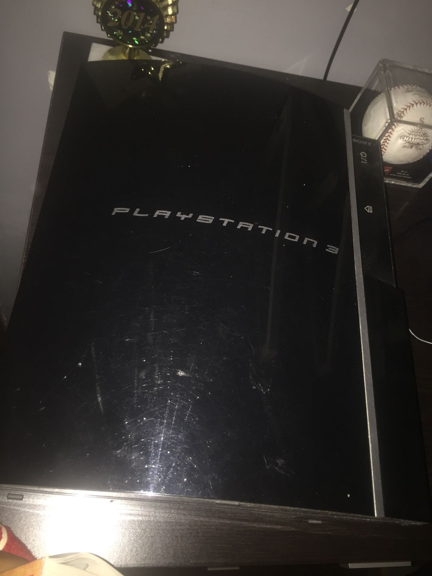 PlayStation 3 with games and a controller