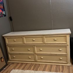 white and creamed colored dresser