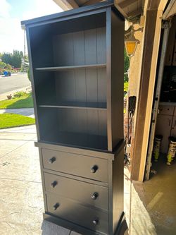 Black tall shelving unit with drawers 72x30x14