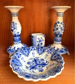 Delfts, Holland hand painted blue & white earthenware, including blue crown stamp. Selling all together: matching pair of candlestick holders, a displ