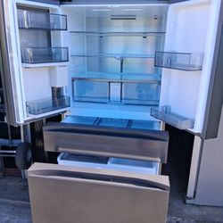Samsung 4-door refrigerator, 36" wide x 68.5" high x 29" deep, in good condition