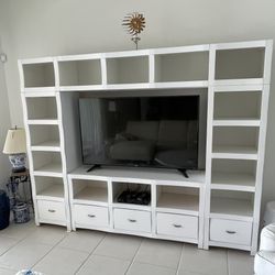 White nice quality wall unit with storage shelves and drawers. Pick up in Jupiter.