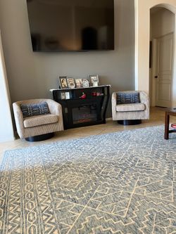 Two beige accent chairs