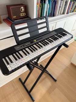 Casio piano keyboard with stand