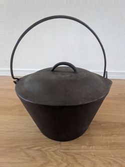 Flat bottomed cast iron kettle with lid and handle