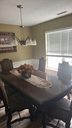 Wood Dining Table sits 8