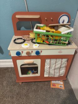 Play kitchen with food and shopping basket
