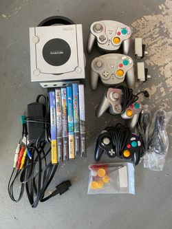 Nintendo GameCube with 4 controllers and games