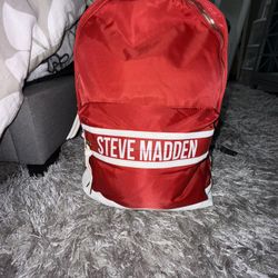 Bright red and white Steve Madden backpack read leather straps