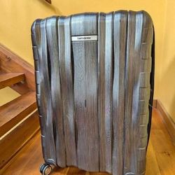Glide Through Travel with Tough Checked Suitcases! population newspaper