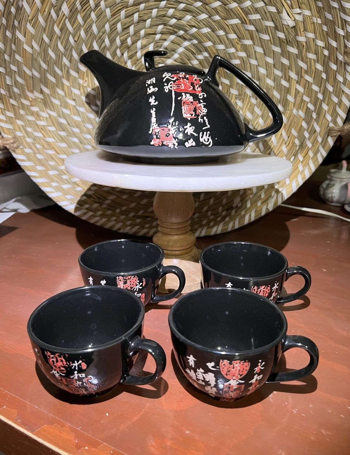 Tea Set. Includes a tea pot and 4 cups. Traditional oriental cups . Black