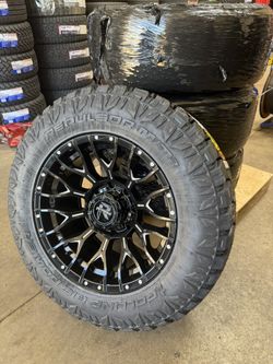 SET OF 20X10 GLOSS BLACK MILLED REVENGE OFFROAD WHEELS ON 35X12.50R20 RBP MT ONLY $1650