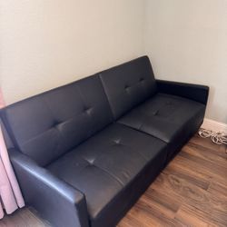 Black Fake leather couch/futon