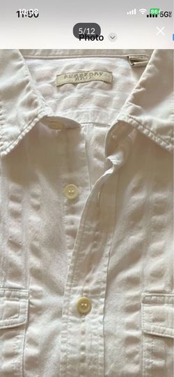 It’s very good shirt for man’s in size Large the color is white made by Burberry