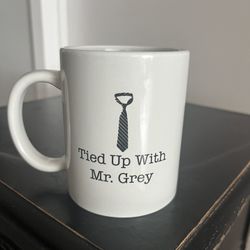 Coffee Mug” Tied Up With Mr Grey” Enjoy your morning coffee with Mr Grey. Ceramic. New. I have 20 of these mugs that are Brand new.  Great for Bookclu